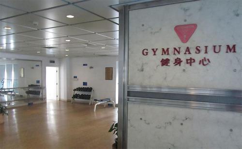 Gym with free weights at International Service Apartments