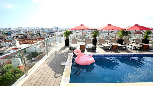 Rooftop swimming pool with a stunning view of Ho Chi Minh City skyline