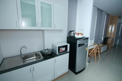 Kitchenette with microwave and electric stove