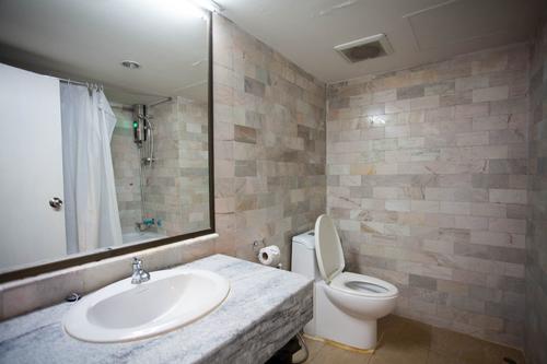 Clean and spacious marble bathroom