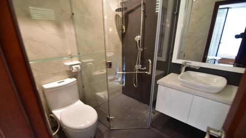 Bathroom with a toilet, shower and sink