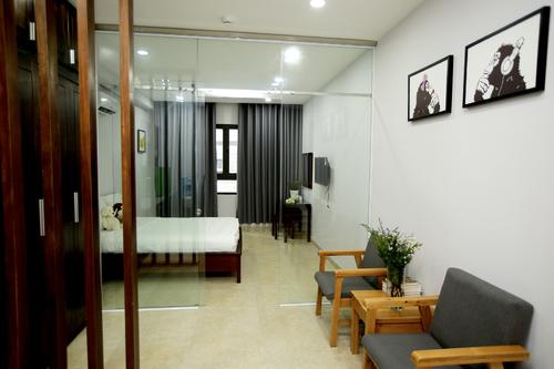 Seperated living room with large glass doors to the bedroom