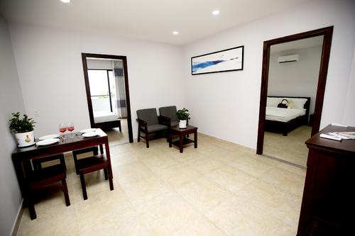 Fully furnished living area with a dining table, and a place to relax