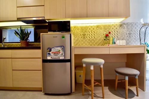 Small kitchenette with a fridge, and electric stove