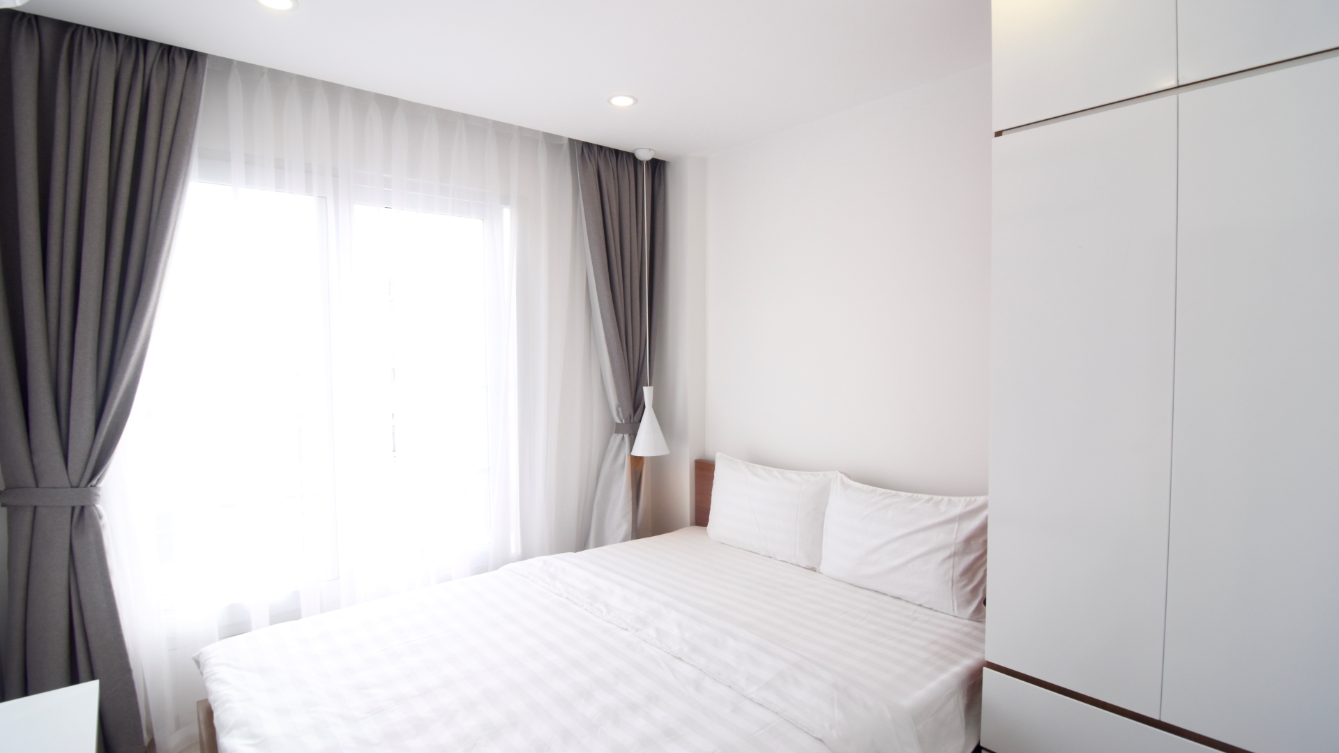 Seperated bedroom with a comfortable bed