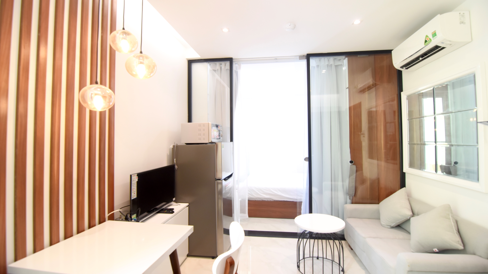 Large living room with a dedicated laptop friendly work area