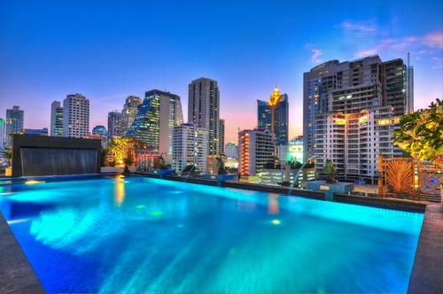 Large swimming pool with a stunning view of Bangkok at Admiral Premier Sukhumvit